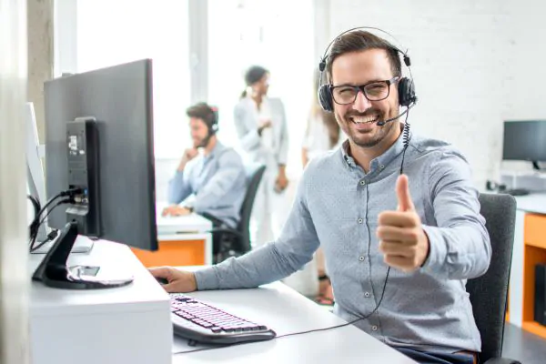 happy male customer service operator showing thumbs up