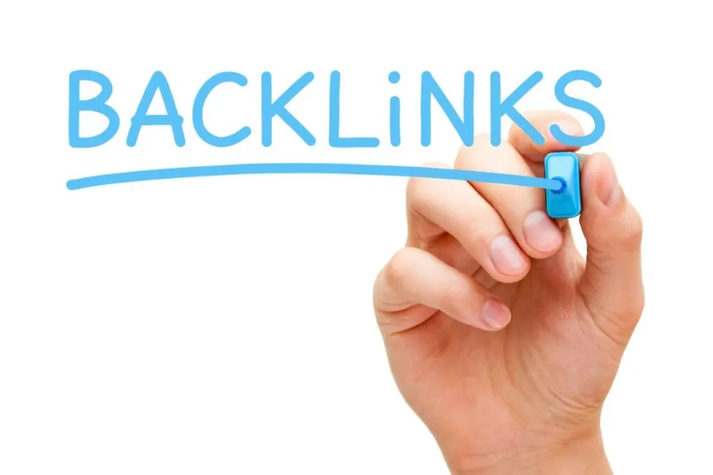 hands holding blue marker writing backlinks