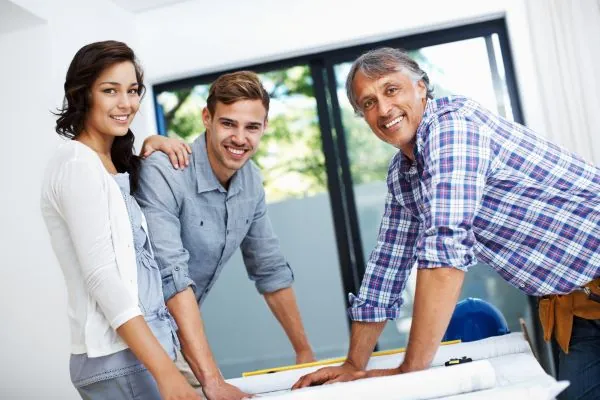 couple discussing with contractor 